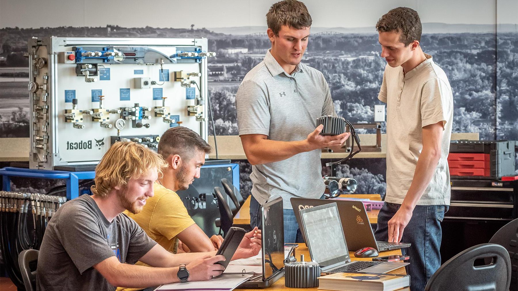 Students working on a project in the engineering classroom.